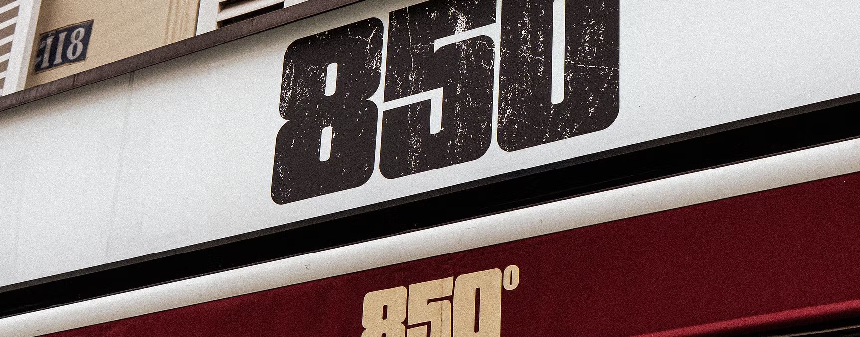 850° Oberkampf – distressed black logo on the fascia and cream logo on the burgundy awning