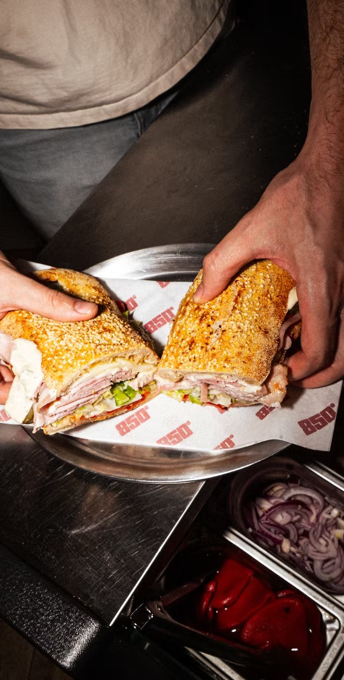 850° Oberkampf – hero sandwich cut in two on 850° printed paper