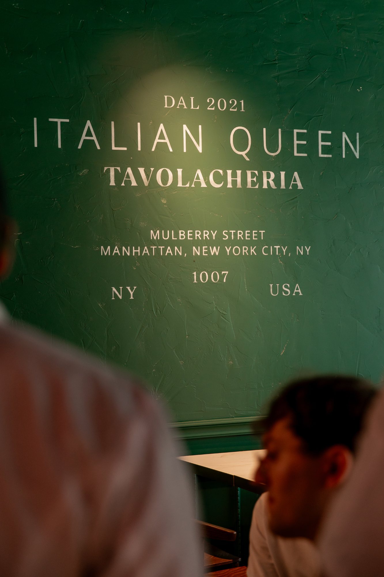 Italian Queen Meylan – Mulberry Street wall inscription on green plaster, photo Jon Filin